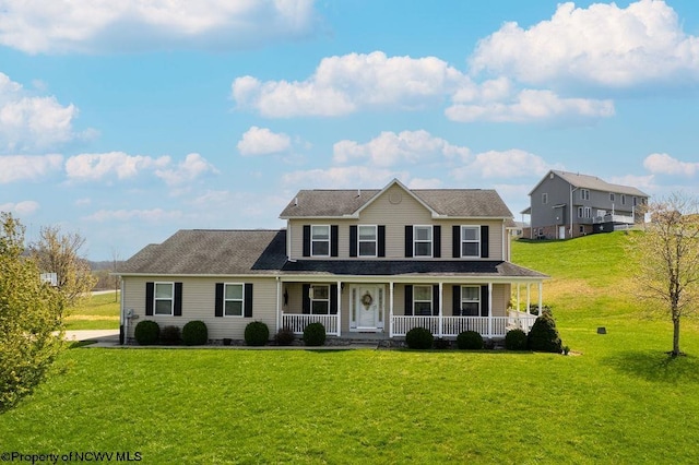 648 Ashberry Dr, Flemington, WV 26347 - colonial inspired home featuring a porch and a front yard