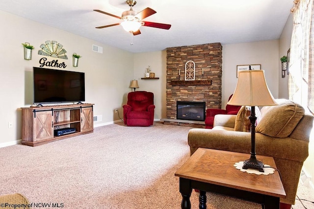 648 Ashberry Dr, Flemington, WV 26347 - carpeted living room featuring baseboards, ceiling fan, a fireplace, and visible vents