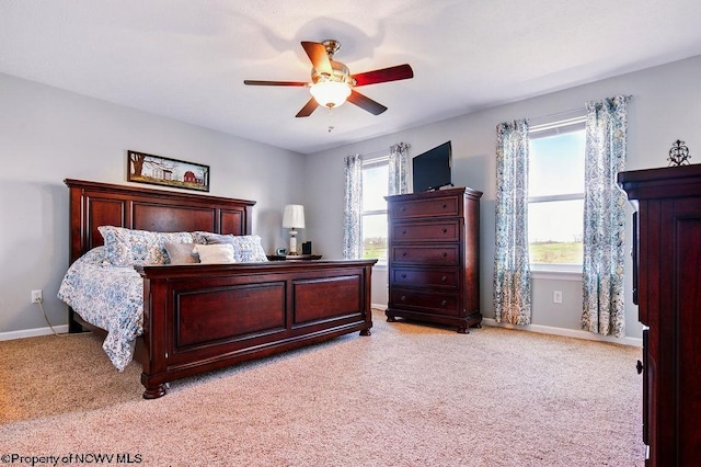 648 Ashberry Dr, Flemington, WV 26347 - bedroom featuring light colored carpet, baseboards, and a ceiling fan