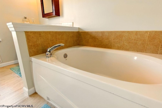 648 Ashberry Dr, Flemington, WV 26347 - full bathroom with a bath, wood finished floors, and baseboards