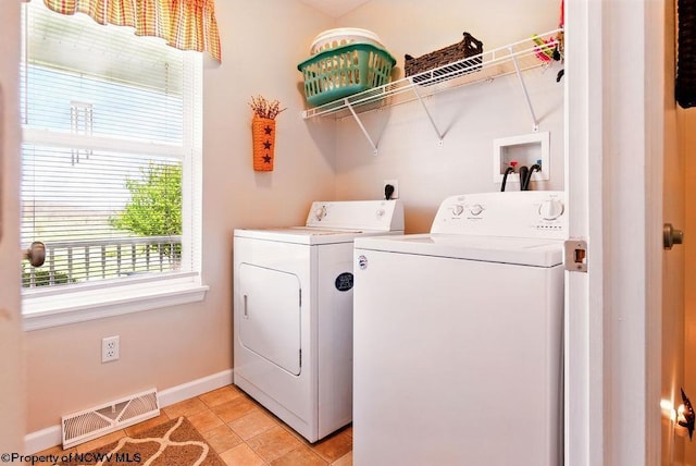 648 Ashberry Dr, Flemington, WV 26347 - clothes washing area featuring baseboards, light tile patterned floors, visible vents, laundry area, and washer and dryer