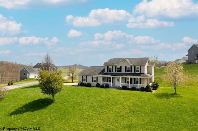 648 Ashberry Dr, Flemington, WV 26347 - view of front facade with a front yard, a porch, and concrete driveway