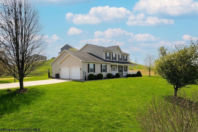 648 Ashberry Dr, Flemington, WV 26347 - traditional-style house featuring an attached garage, driveway, a front lawn, and a porch