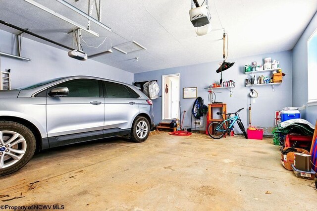 648 Ashberry Dr, Flemington, WV 26347 - garage featuring a garage door opener
