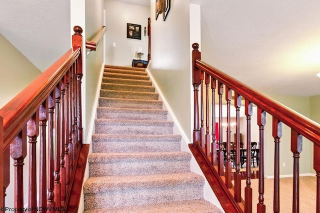 648 Ashberry Dr, Flemington, WV 26347 - stairs with carpet flooring, baseboards, and a textured ceiling