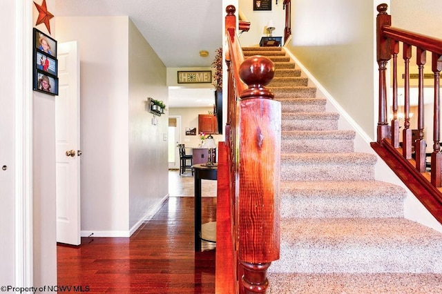 648 Ashberry Dr, Flemington, WV 26347 - stairs with baseboards and wood finished floors