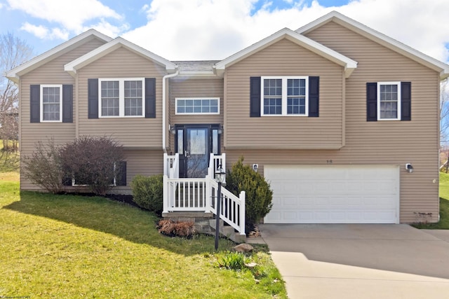 split foyer home featuring an attached garage, driveway, and a front lawn