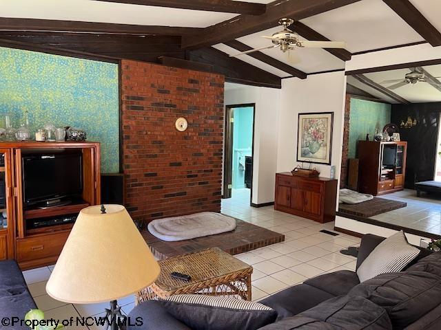 140 Roney Rd, Elkins, WV 26241 - living room featuring ceiling fan, vaulted ceiling with beams, and light tile patterned floors
