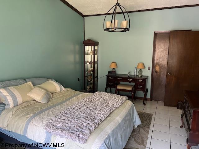 140 Roney Rd, Elkins, WV 26241 - bedroom with light tile patterned floors and crown molding