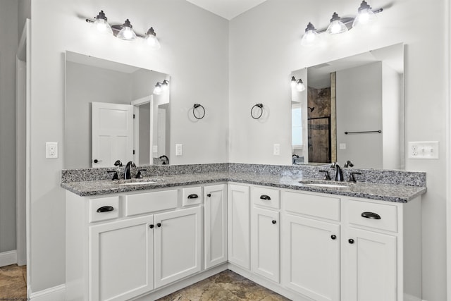 full bath with a sink and double vanity
