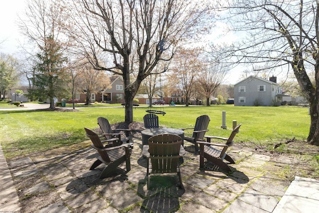 view of patio / terrace featuring an outdoor fire pit