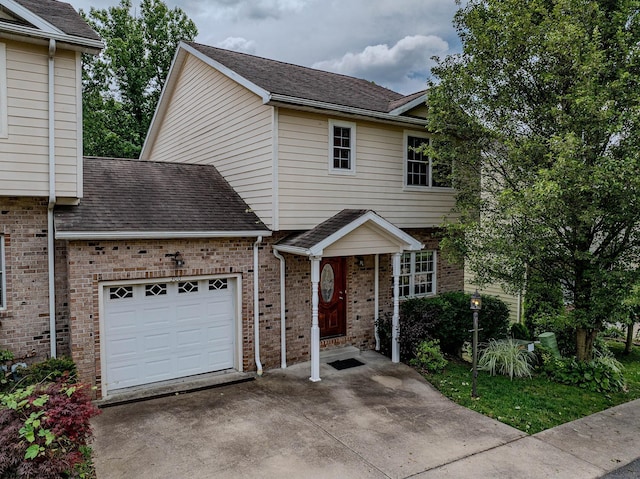 306 Villa View Dr, Morgantown, WV 26505 - townhome / multi-family property with a garage, brick siding, a shingled roof, and concrete driveway