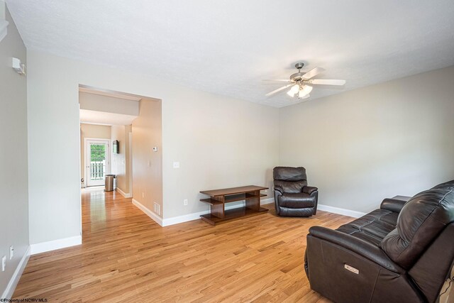 306 Villa View Dr, Morgantown, WV 26505 - living area featuring baseboards, a ceiling fan, and light wood finished floors