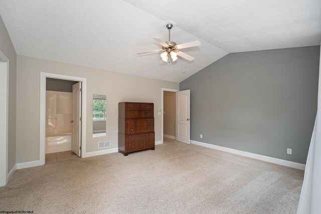 306 Villa View Dr, Morgantown, WV 26505 - unfurnished bedroom featuring ensuite bath, baseboards, light colored carpet, lofted ceiling, and visible vents