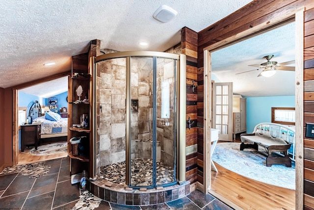 ensuite bathroom featuring a textured ceiling, ensuite bath, and a stall shower