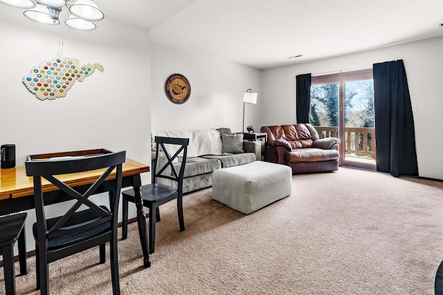 1224 Van Voorhis Rd, Morgantown, WV 26505 - carpeted living area with visible vents and a chandelier