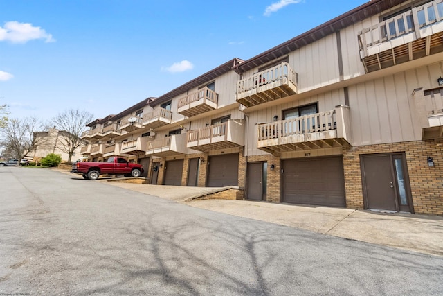1224 Van Voorhis Rd, Morgantown, WV 26505 - view of building exterior featuring driveway, a residential view, and a garage
