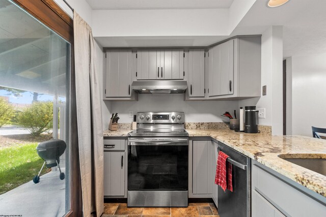 1224 Van Voorhis Rd, Morgantown, WV 26505 - kitchen featuring light stone counters, under cabinet range hood, stainless steel appliances, and gray cabinetry