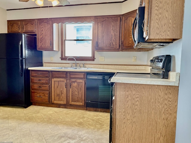 kitchen with ceiling fan, light countertops, a sink, and black appliances