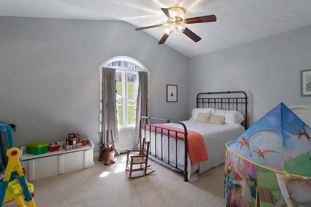 bedroom with lofted ceiling, carpet flooring, and ceiling fan