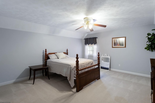 bedroom with light carpet, baseboards, and ceiling fan
