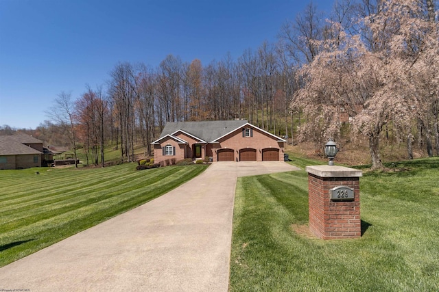 view of front of house with a front lawn, driveway, and a garage