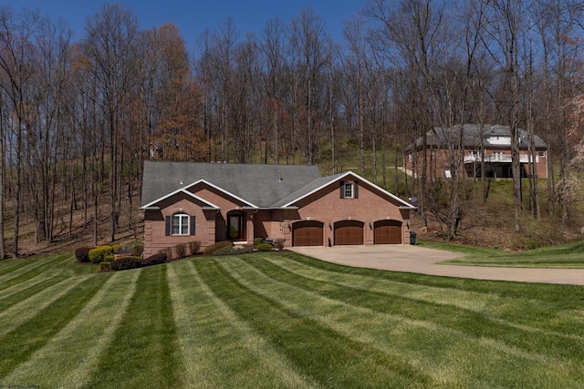 view of front facade featuring concrete driveway, a front lawn, brick siding, and a garage