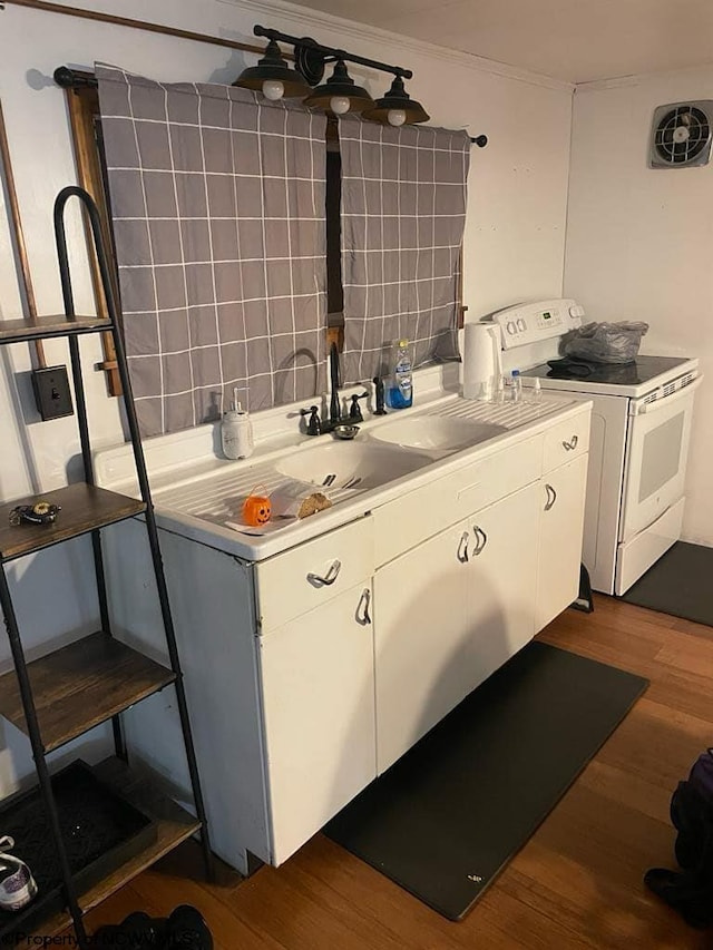 740 Point Mountain Rd, Webster Springs, WV 26288 - kitchen with light countertops, wood finished floors, white cabinetry, and white range with electric stovetop