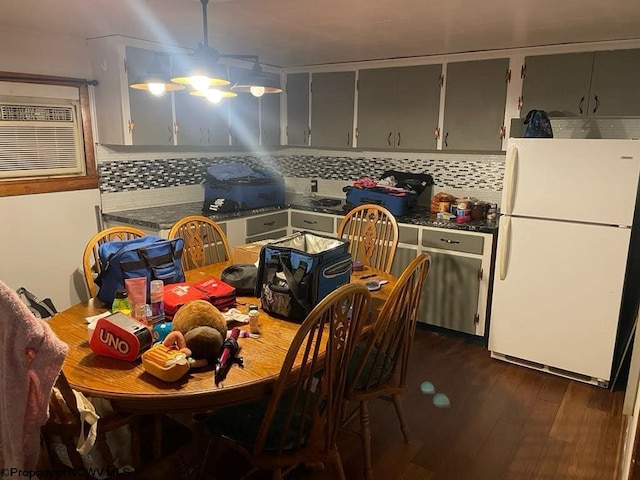 740 Point Mountain Rd, Webster Springs, WV 26288 - kitchen featuring dark countertops, dark wood-type flooring, freestanding refrigerator, decorative backsplash, and gray cabinetry