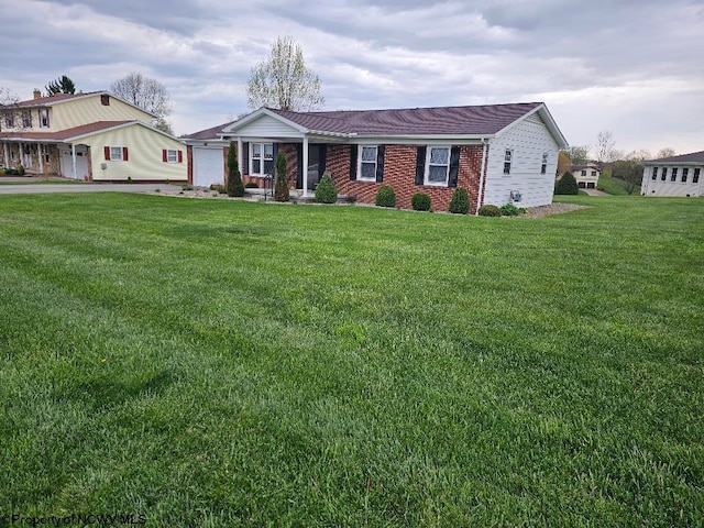 ranch-style home with a front lawn