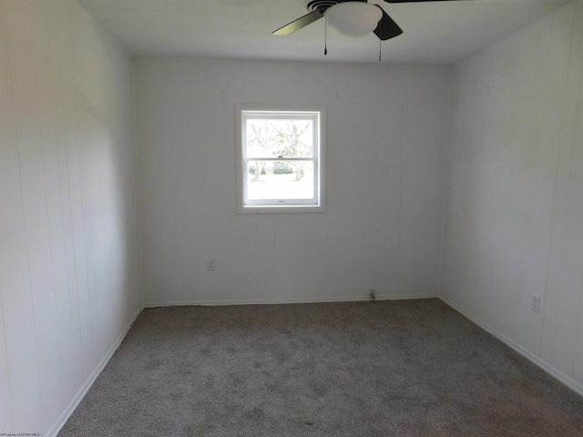 unfurnished room featuring carpet and a ceiling fan