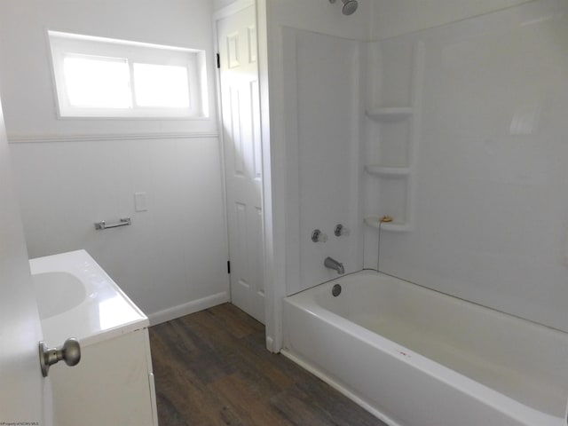 full bathroom featuring bathtub / shower combination, vanity, and wood finished floors