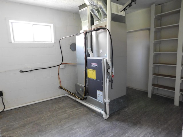 utility room with heating unit