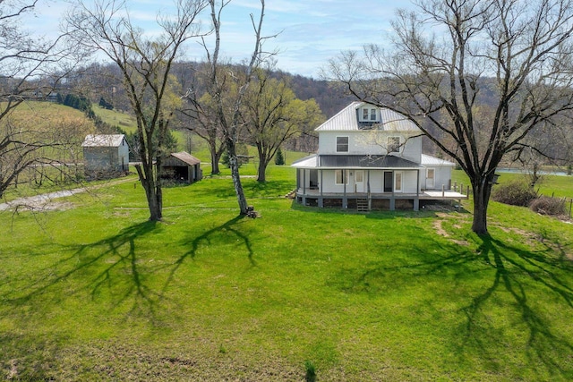 view of yard with covered porch