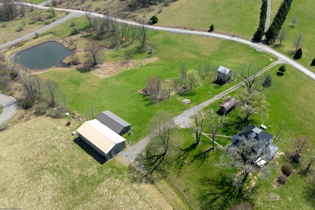 drone / aerial view featuring a rural view and a water view