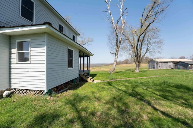 view of yard featuring entry steps