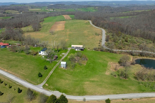 birds eye view of property with a rural view