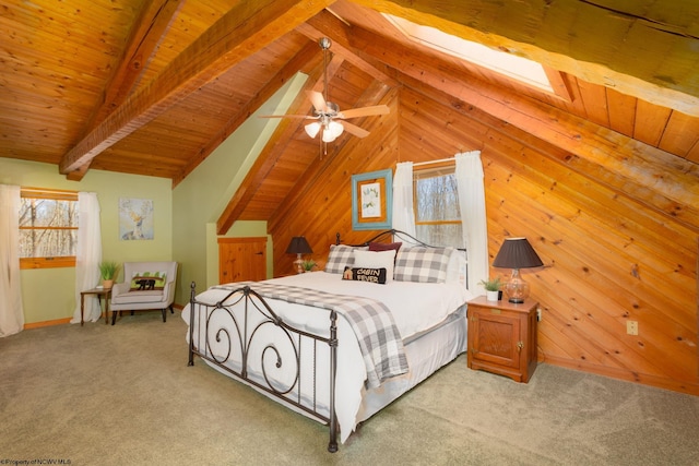 bedroom featuring wooden walls, lofted ceiling with beams, wooden ceiling, and light carpet