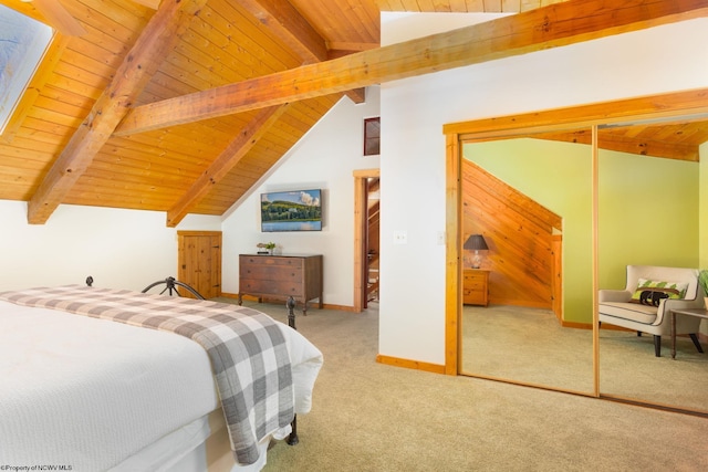 carpeted bedroom featuring baseboards, a closet, vaulted ceiling with beams, and wooden ceiling