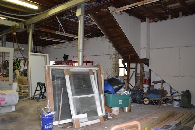 miscellaneous room with unfinished concrete floors