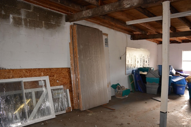 miscellaneous room with concrete block wall