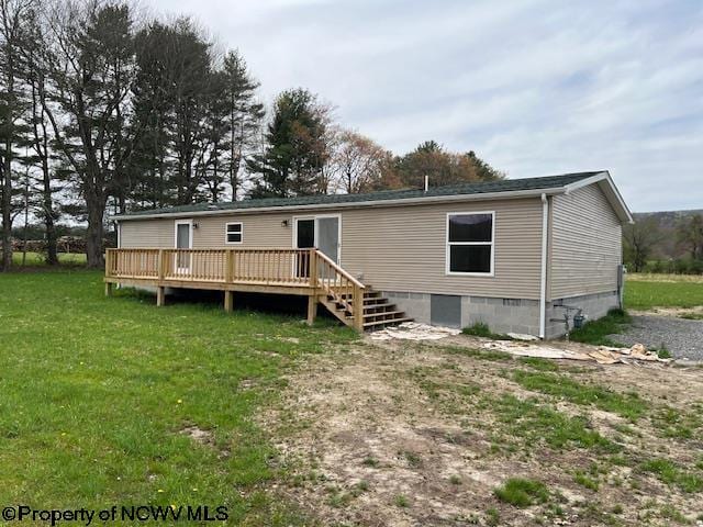 back of house with a lawn, a wooden deck, and crawl space