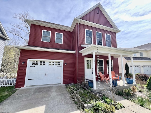 1029 Olivia Way, Morgantown, WV 26508 - craftsman house with fence, concrete driveway, board and batten siding, a porch, and a garage