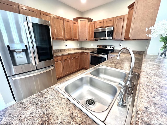 1029 Olivia Way, Morgantown, WV 26508 - kitchen with brown cabinets, recessed lighting, stainless steel appliances, and a sink