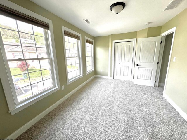 1029 Olivia Way, Morgantown, WV 26508 - unfurnished bedroom with visible vents, baseboards, carpet floors, and multiple windows