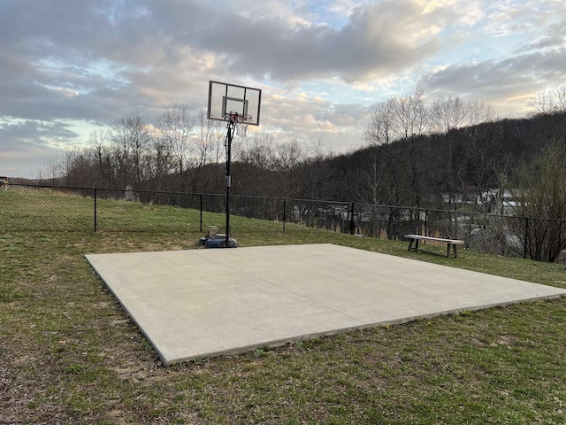 1029 Olivia Way, Morgantown, WV 26508 - view of basketball court featuring fence, a lawn, and basketball hoop