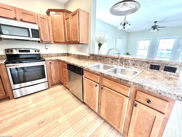 1029 Olivia Way, Morgantown, WV 26508 - kitchen with a ceiling fan, a sink, light wood-style floors, stainless steel appliances, and light countertops