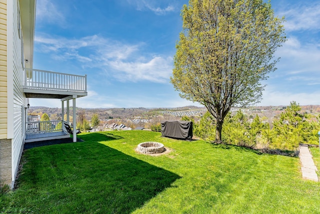 view of yard with a fire pit
