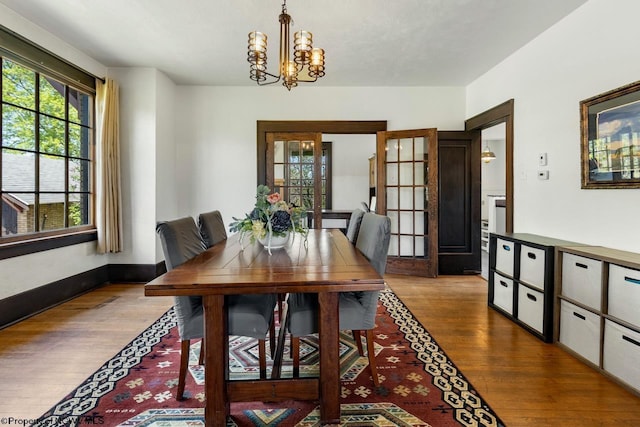 1042 Fort Martin Rd, Maidsville, WV 26541 - dining room with a chandelier, baseboards, and dark wood-style flooring