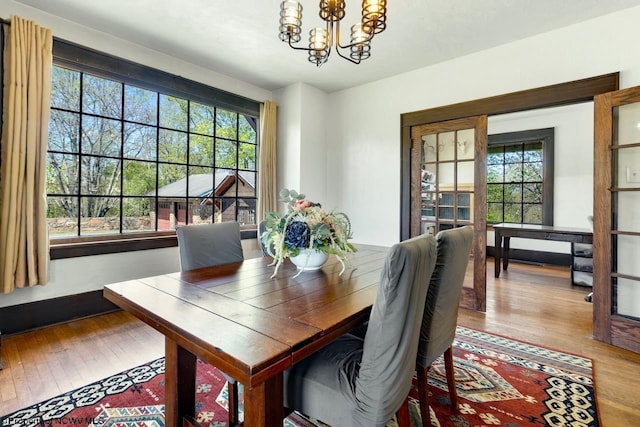 1042 Fort Martin Rd, Maidsville, WV 26541 - dining room with hardwood / wood-style floors, a notable chandelier, and baseboards